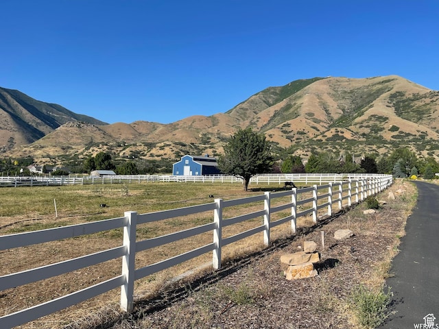 view of mountain feature with a rural view