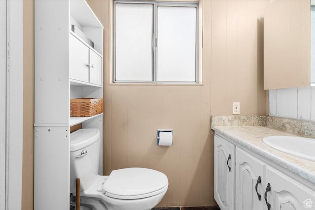 bathroom featuring toilet and vanity