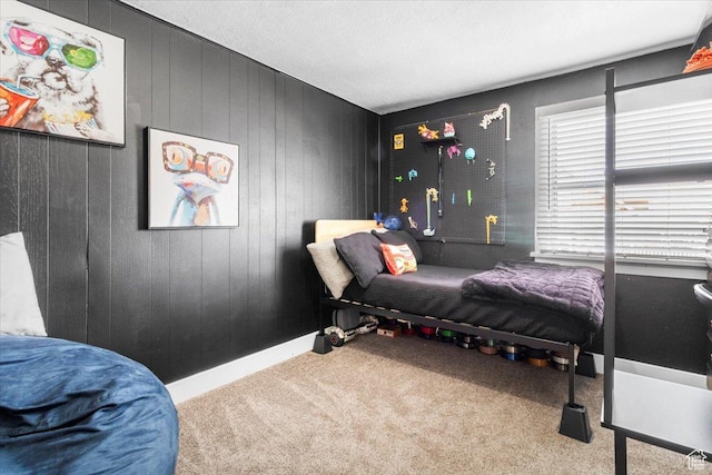 carpeted bedroom with baseboards