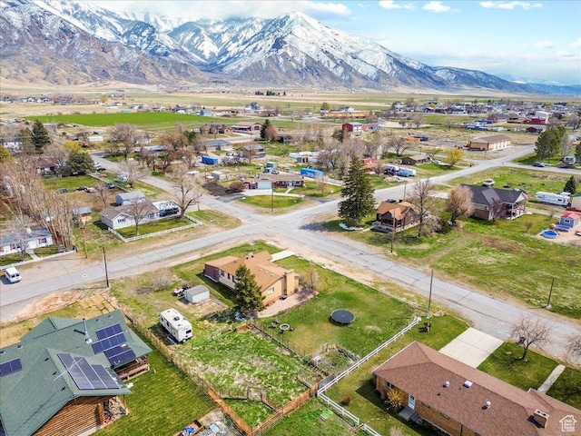 drone / aerial view with a residential view and a mountain view