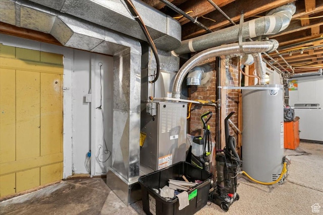utility room with washer / clothes dryer and gas water heater