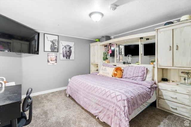 bedroom featuring baseboards and carpet floors