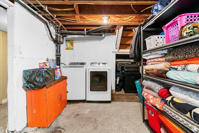 clothes washing area with independent washer and dryer and laundry area
