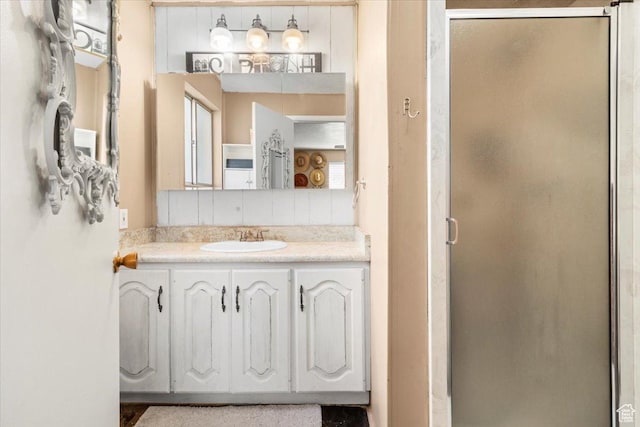 bathroom with vanity and a shower stall