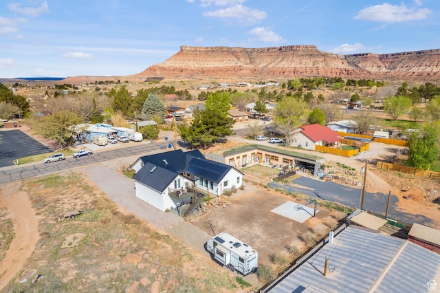 birds eye view of property featuring a mountain view