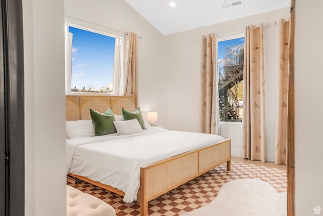 bedroom with light floors, visible vents, lofted ceiling, and recessed lighting
