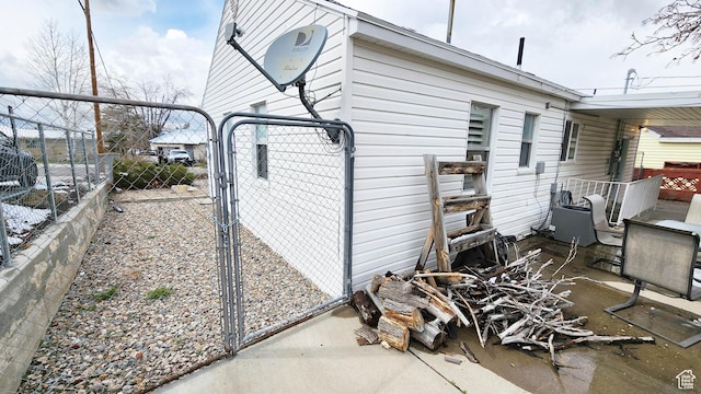 view of home's exterior featuring a gate and fence