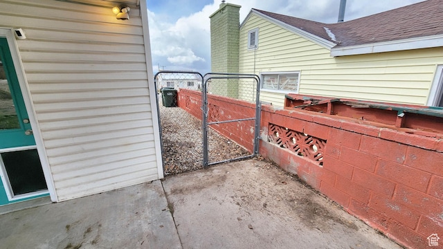 view of gate featuring fence