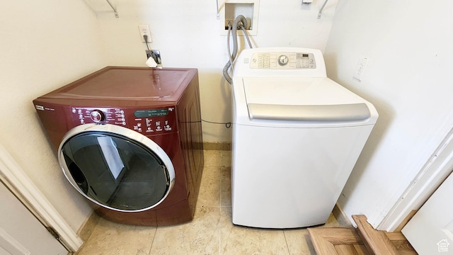 laundry room with washing machine and dryer and laundry area