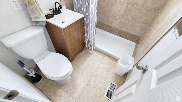 bathroom with a shower stall, visible vents, toilet, and vanity