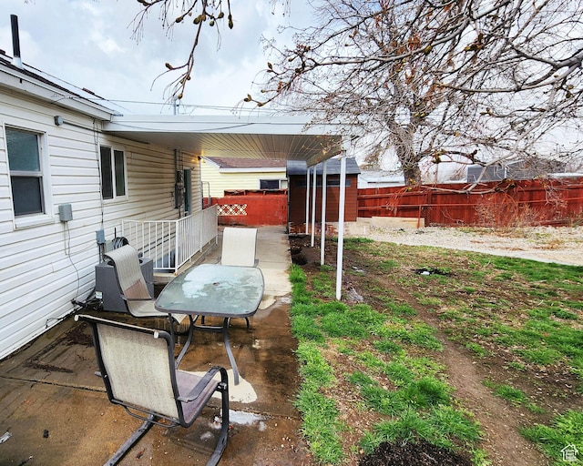 view of yard with a patio and fence