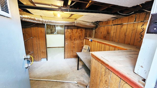 unfinished basement with wood walls