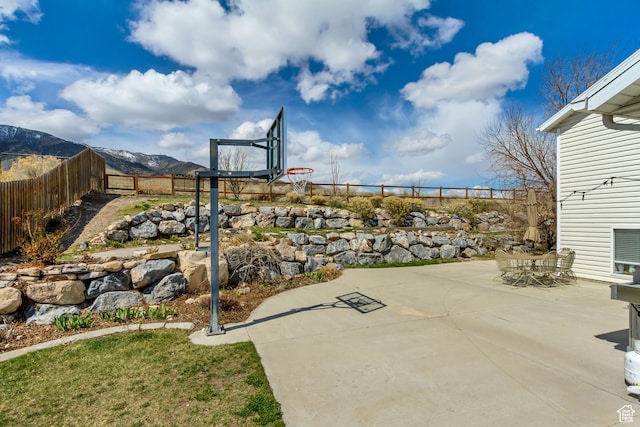 4103 S Sunrise Dr, Saratoga Springs, UT 84045 - view of sport court with a fenced backyard and a mountain view