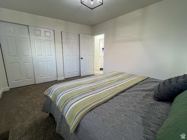 6770 W 3860 S, West Valley City, UT 84128 - carpeted bedroom featuring two closets, baseboards, and visible vents