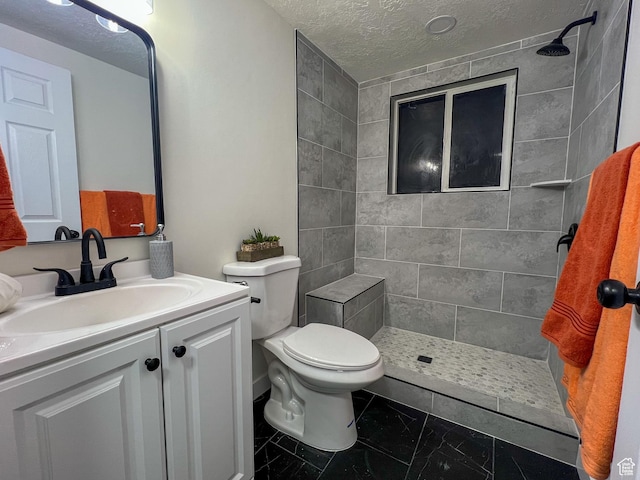 6770 W 3860 S, West Valley City, UT 84128 - full bath with toilet, vanity, a tile shower, and a textured ceiling