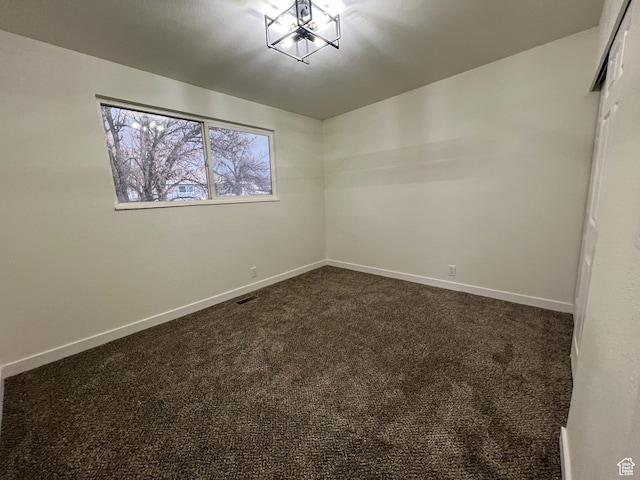 6770 W 3860 S, West Valley City, UT 84128 - spare room with baseboards, visible vents, and dark carpet