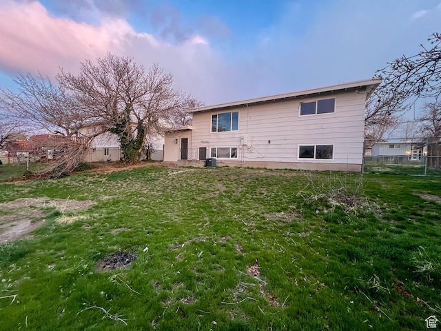 6770 W 3860 S, West Valley City, UT 84128 - rear view of property featuring fence and a yard