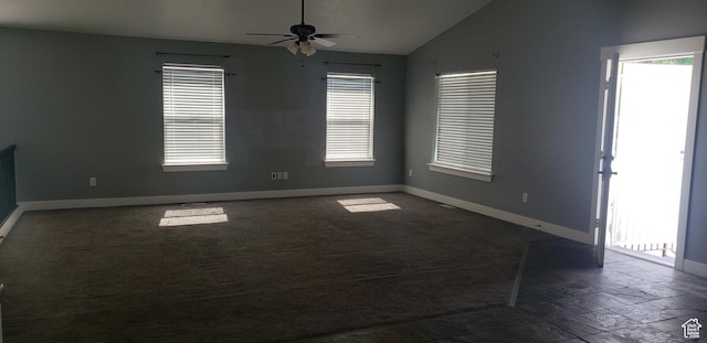 294 W 200 N, Spanish Fork, UT 84660 - empty room with lofted ceiling, baseboards, ceiling fan, stone tile floors, and dark colored carpet