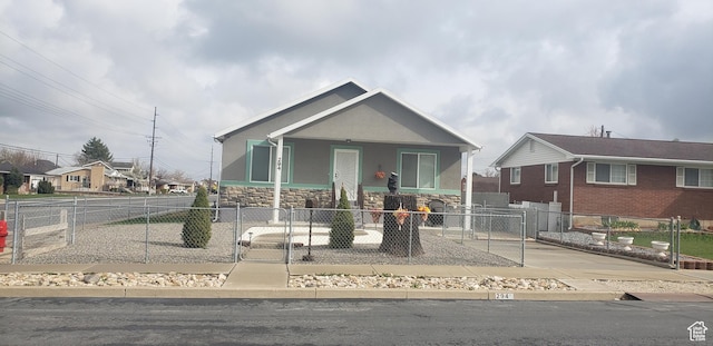 294 W 200 N, Spanish Fork, UT 84660 - view of front of property with a fenced front yard, stone siding, a porch, and a gate