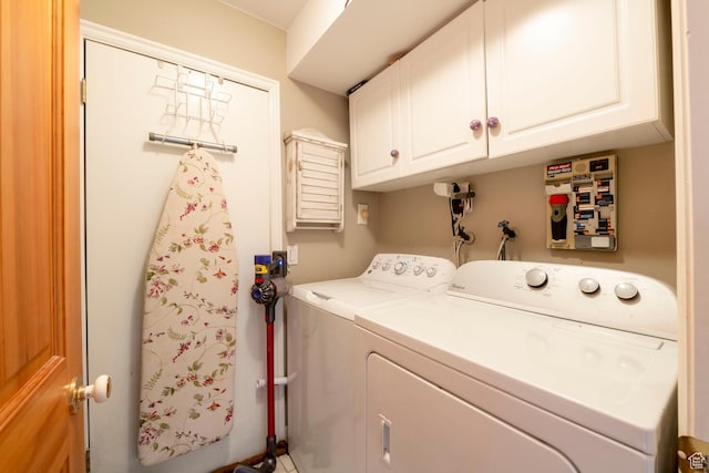 laundry area featuring washing machine and dryer and cabinet space