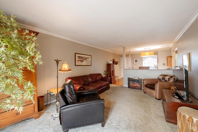 living room featuring baseboards, carpet flooring, ornamental molding, and a glass covered fireplace