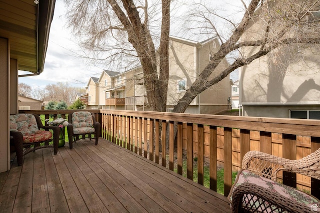 wooden deck with a residential view