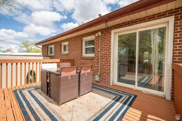 3839 S 2050 W, Roy, UT 84067 - wooden deck with outdoor dining space
