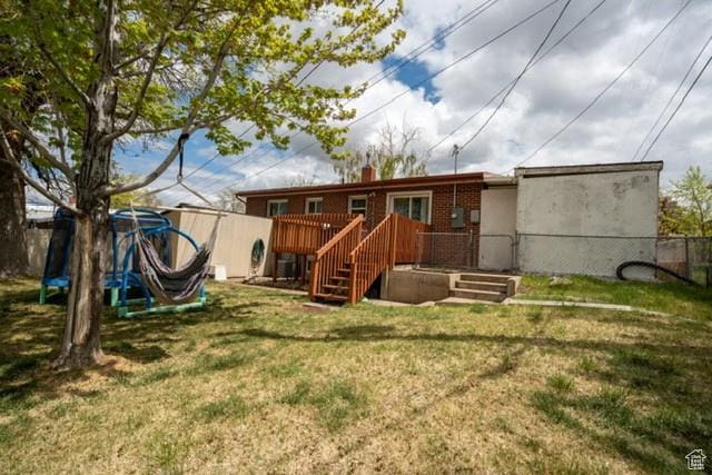 3839 S 2050 W, Roy, UT 84067 - rear view of house featuring a wooden deck, a chimney, and stairs