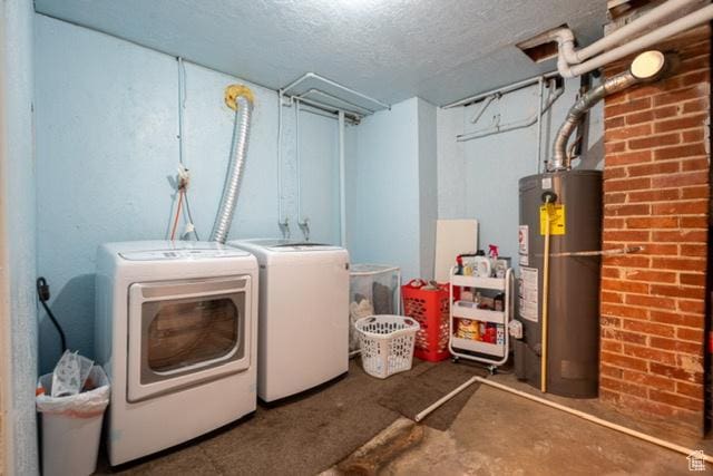 3839 S 2050 W, Roy, UT 84067 - clothes washing area featuring washing machine and clothes dryer, gas water heater, and a textured ceiling