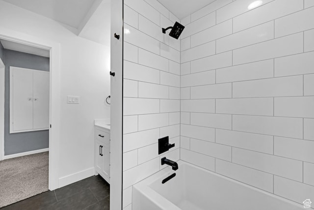 full bath with tile patterned floors, vanity, baseboards, and bathtub / shower combination