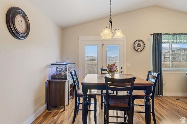 1234 S 1150 W, Payson, UT 84651 - dining room with lofted ceiling, wood finished floors, a chandelier, and baseboards