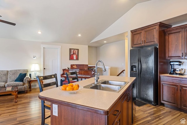 1234 S 1150 W, Payson, UT 84651 - kitchen with black fridge with ice dispenser, a sink, vaulted ceiling, wood finished floors, and open floor plan