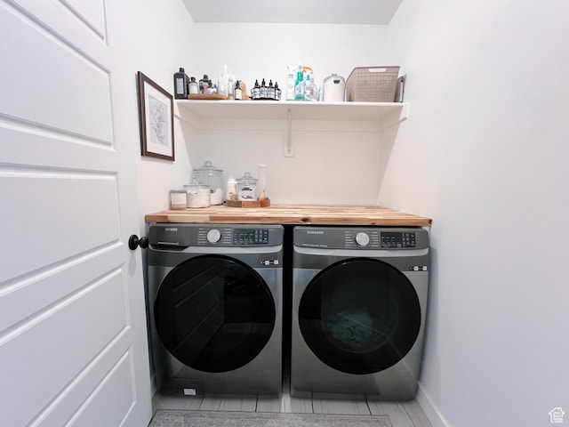 laundry room with washer and clothes dryer and laundry area