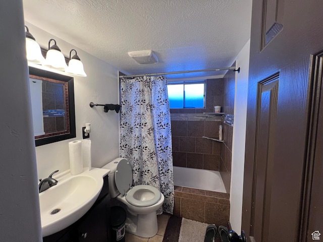 174 N 500 E, Logan, UT 84321 - bathroom with vanity, tile patterned flooring, a textured ceiling, toilet, and tiled shower / bath combo