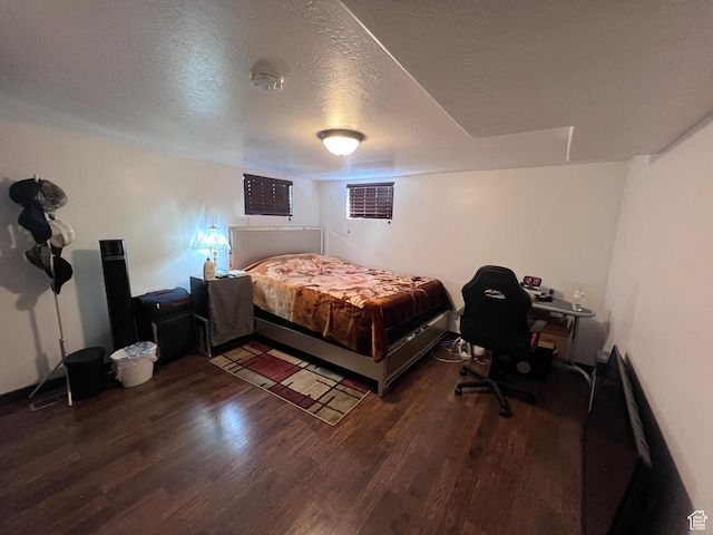 174 N 500 E, Logan, UT 84321 - bedroom with a textured ceiling and wood finished floors