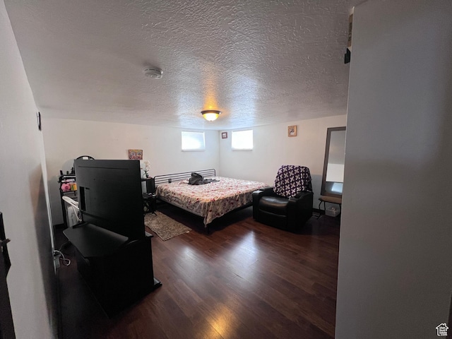 174 N 500 E, Logan, UT 84321 - bedroom featuring a textured ceiling and wood finished floors