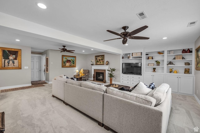 945 E Diana Way, Sandy, UT 84094 - living room with visible vents, a ceiling fan, light colored carpet, and a glass covered fireplace