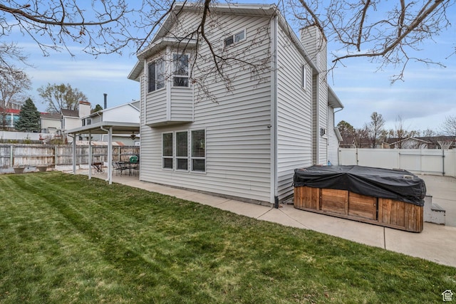945 E Diana Way, Sandy, UT 84094 - rear view of house featuring a patio, a yard, a fenced backyard, and a hot tub