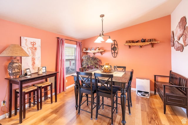 69 E Coronado Ln, Moab, UT 84532 - dining space featuring wood finished floors, baseboards, and lofted ceiling