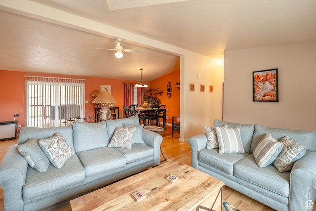 69 E Coronado Ln, Moab, UT 84532 - living area with light wood-style floors, baseboards, beam ceiling, and ceiling fan