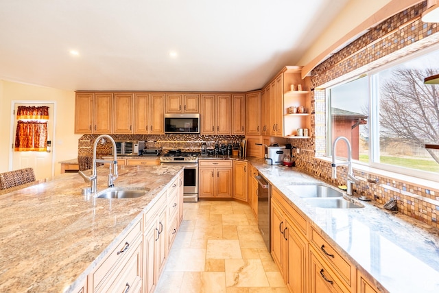 69 E Coronado Ln, Moab, UT 84532 - kitchen featuring appliances with stainless steel finishes, decorative backsplash, and a sink