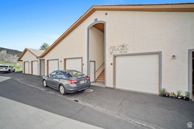 view of side of home with stucco siding