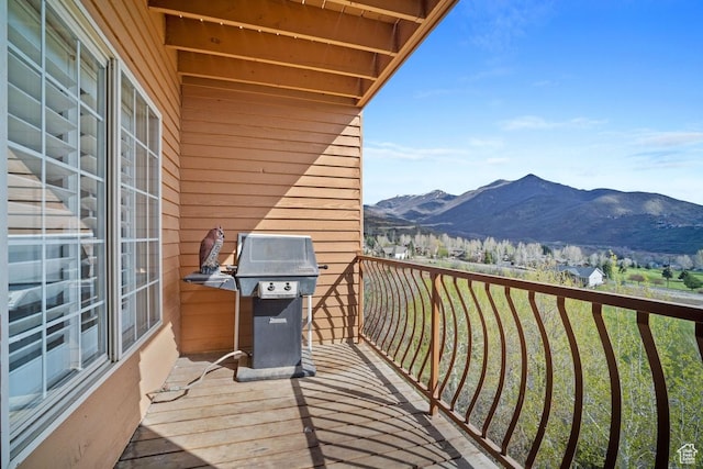 balcony with a mountain view and area for grilling