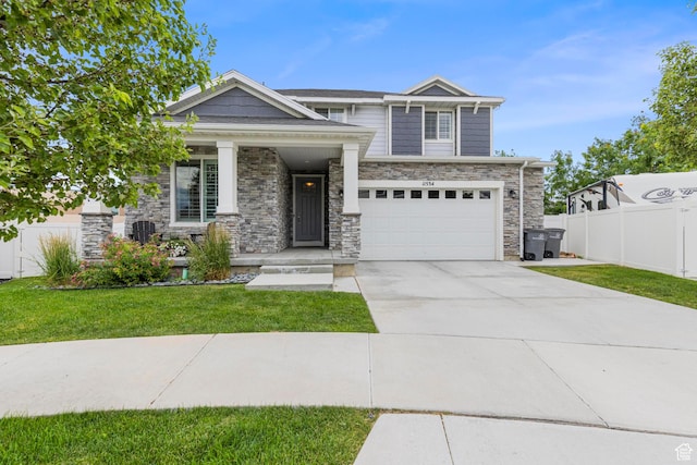 11534 S Rk Cv, South Jordan, UT 84095 - craftsman inspired home with stone siding, an attached garage, driveway, and a porch