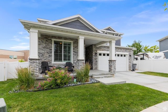 11534 S Rk Cv, South Jordan, UT 84095 - craftsman-style home featuring covered porch, concrete driveway, stone siding, and a garage