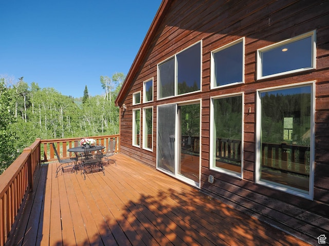 deck featuring outdoor dining area
