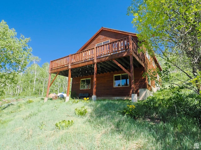 rear view of property with a wooden deck