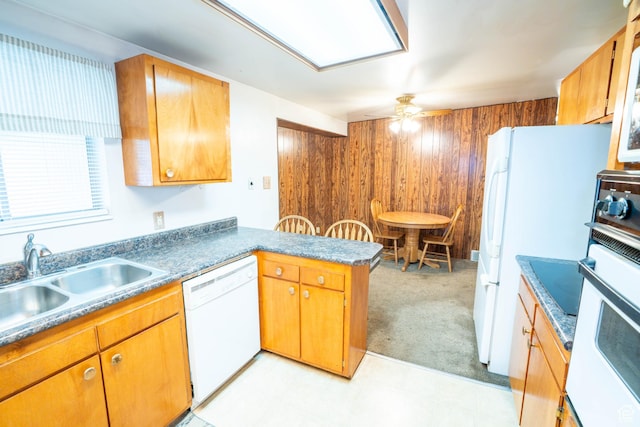 1915 W 13400 S, Riverton, UT 84065 - kitchen featuring white appliances, a peninsula, ceiling fan, a sink, and wooden walls