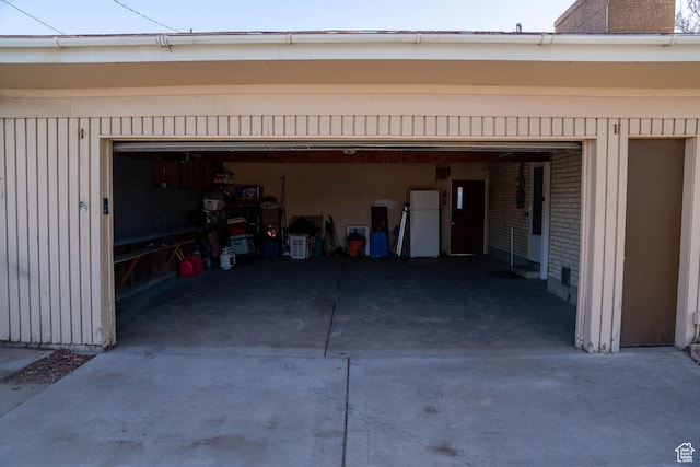 1915 W 13400 S, Riverton, UT 84065 - garage featuring driveway and freestanding refrigerator
