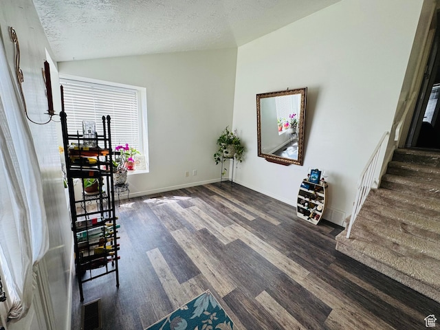 1107 E 2450 N, Layton, UT 84040 - unfurnished dining area featuring visible vents, a textured ceiling, wood finished floors, and lofted ceiling
